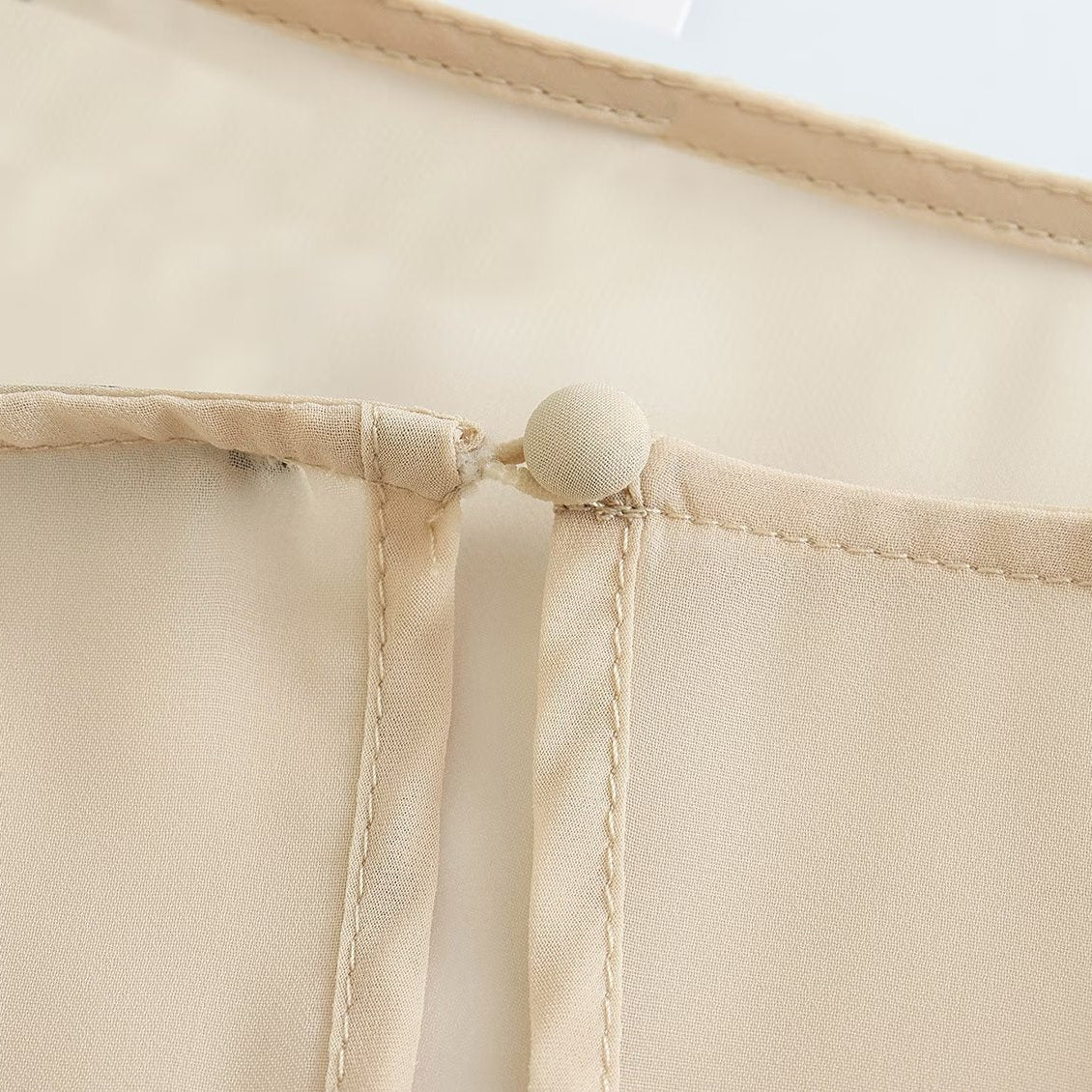 Blusa Capa Assimétrica