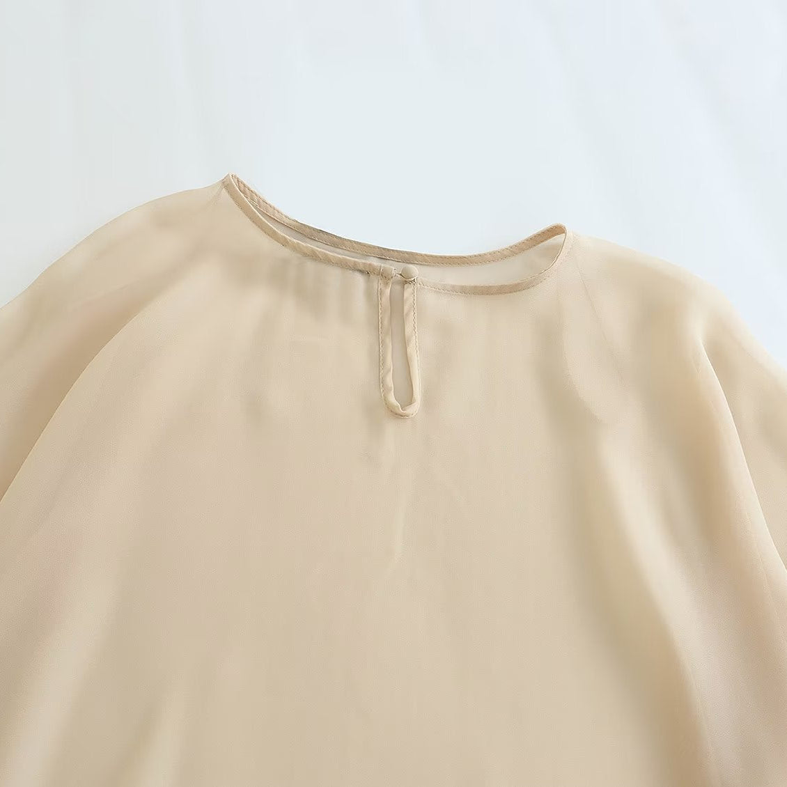 Blusa Capa Assimétrica