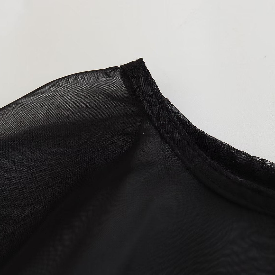 Blusa Capa Assimétrica