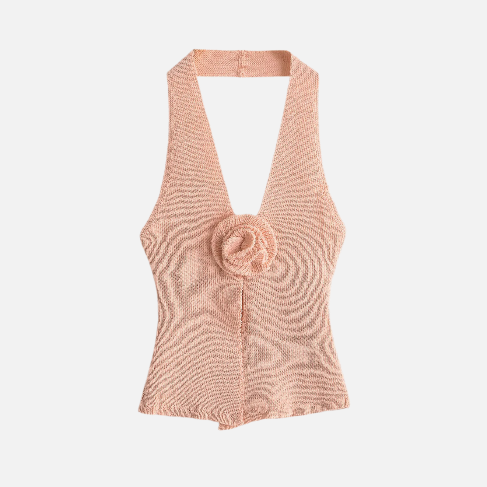 Blusa Flor Sunny rosa claro com flor no busto, decote halter profundo e fenda frontal. Visual romântico e moderno. Tamanhos P ao G.

