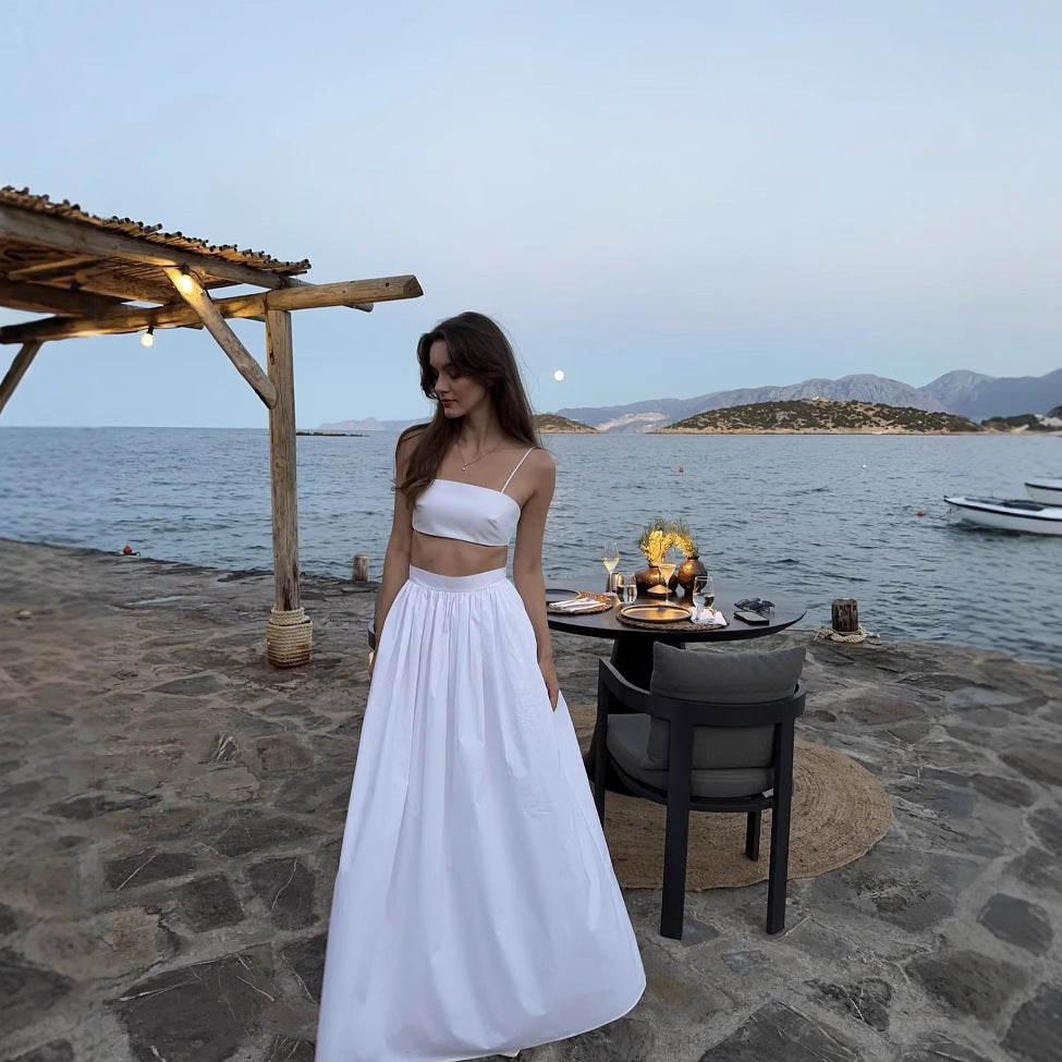 Conjunto Ceci com top ajustado e saia longa fluida com bolsos. Look leve e feminino, disponível em 4 cores. Tamanhos P ao G.

