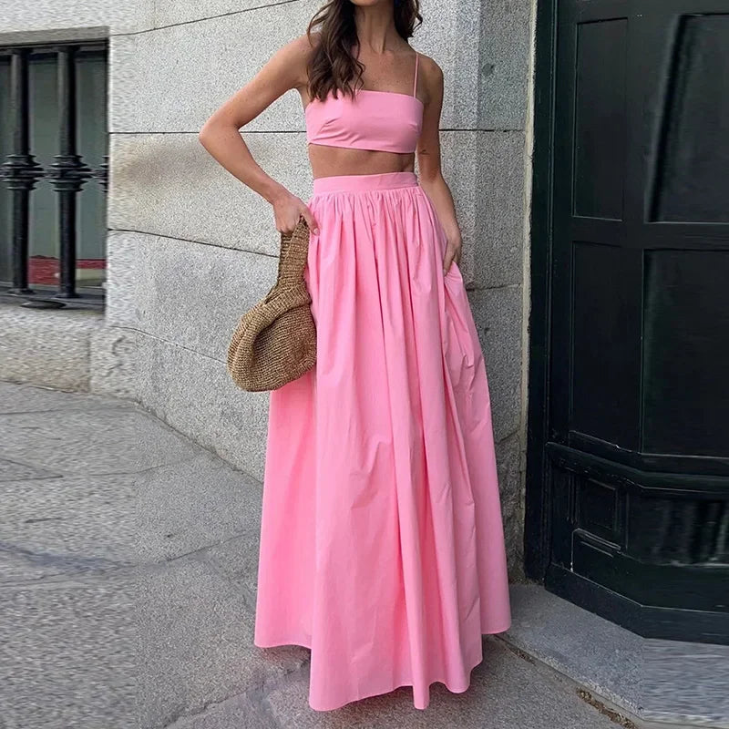 Conjunto Ceci com top ajustado e saia longa fluida com bolsos. Look leve e feminino, disponível em 4 cores. Tamanhos P ao G.

