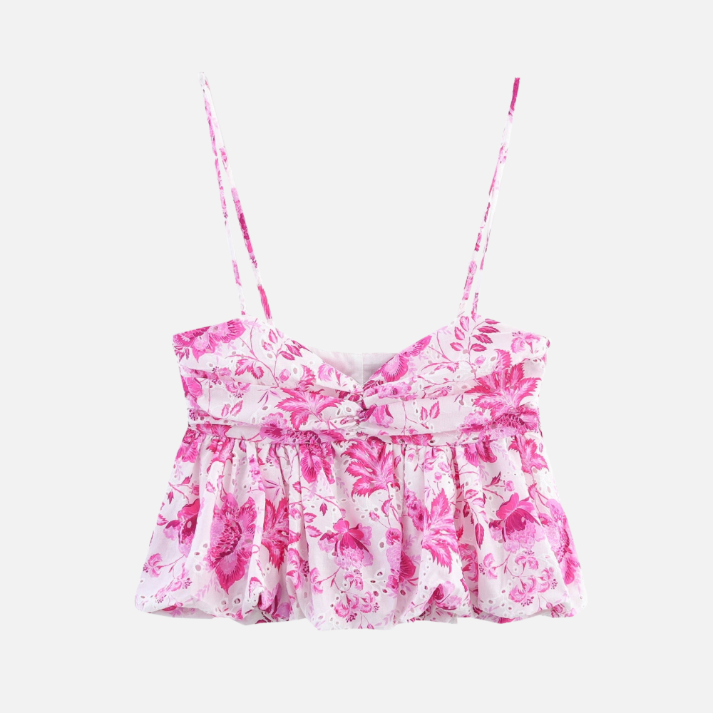 Top Floral Savana com estampa rosa sobre branco, alças finas e caimento solto. Visual leve e romântico. Tamanhos PP ao G.

